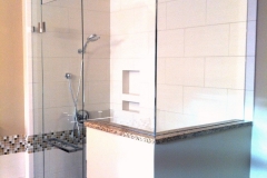 Glass shower door with pony wall