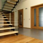 Modern residential staircase with clear glass railing