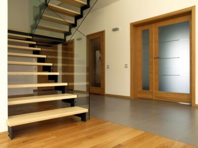 Modern residential staircase with clear glass railing