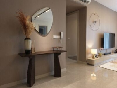 Decorative mirror above a console table in a modern home
