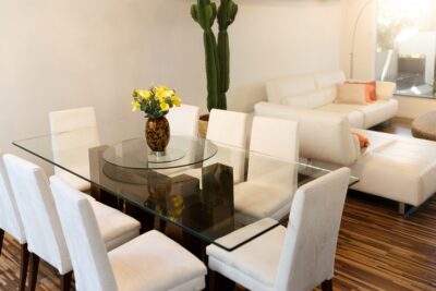 Glass dining table in a contemporary home interior.
