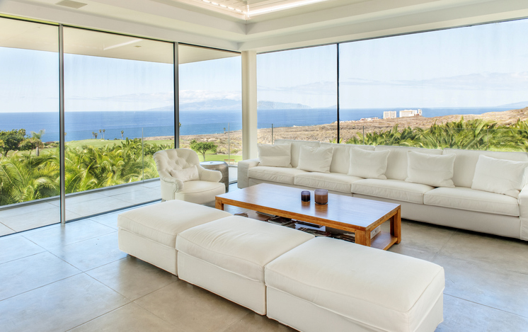 A glassed living room window helps increase natural light in the home.