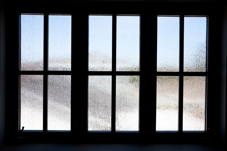 A textured glass window that reduces visibility.