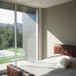 Glass wall panels that improve your bedroom lighting.