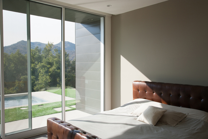 Glass wall panels that improve your bedroom lighting.