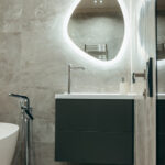 Illuminated bathroom mirror helps improve lighting and enhances visibility.