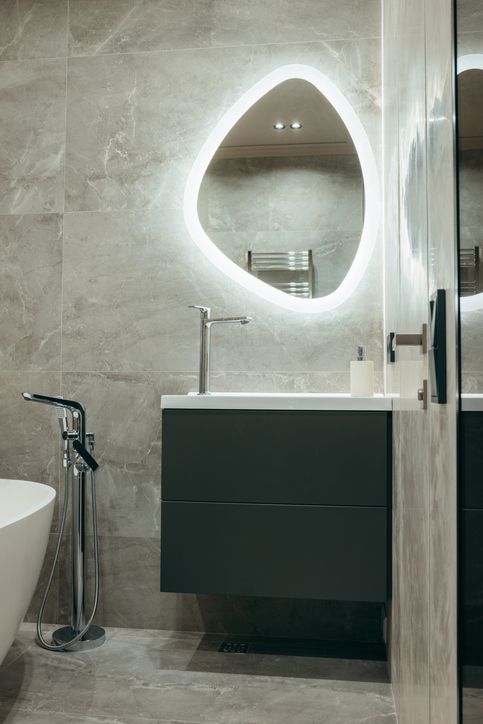 Illuminated bathroom mirror helps improve lighting and enhances visibility.