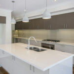 A kitchen space featuring recycled glass countertops.