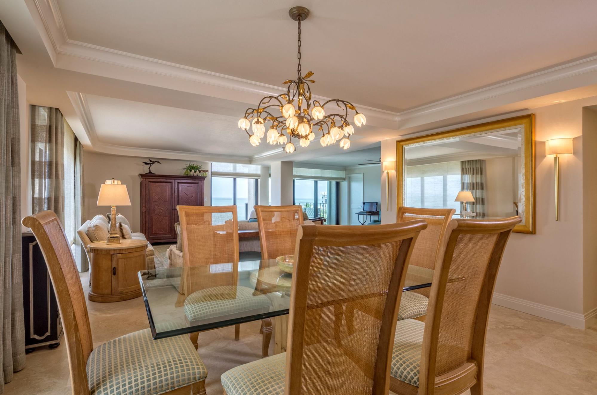 A dining area with an antique mirror that creates an intimate ambiance during meal time.