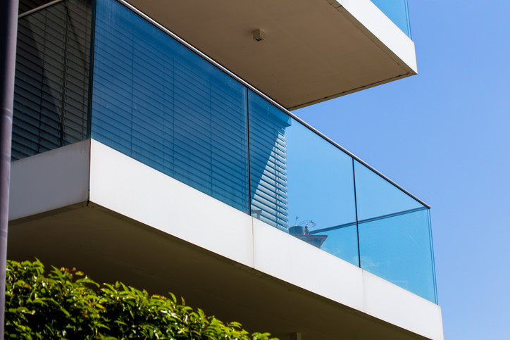 Installing an exterior glass railings to expand the outdoor living space.