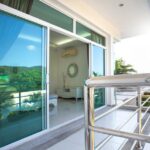A sliding door with tinted mirrors that incorporates summer style into home décor.