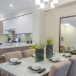 A custom-framed mirror used as a focal point on the dining table.